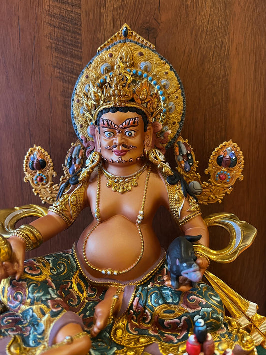 Handcrafted Yellow Dzambhal Brass Statue – Nepalese Style Tibetan Buddhist Deity with Painted Back Panel (9 inch)