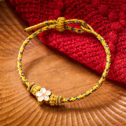 Buddha Stones Yellow Braided Rope Flower Rootedness Bracelet