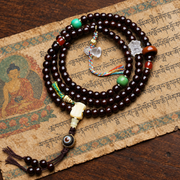 EverestArtstudios Coconut Barrel-Bead Mala with Agate and Crystal Lotus Accents — styled on wood with a scripture display prop