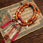 EverestArtstudios Bone 108-Bead Mala with Carved and Metal-Tone Accents — styled on wood with a scripture display prop