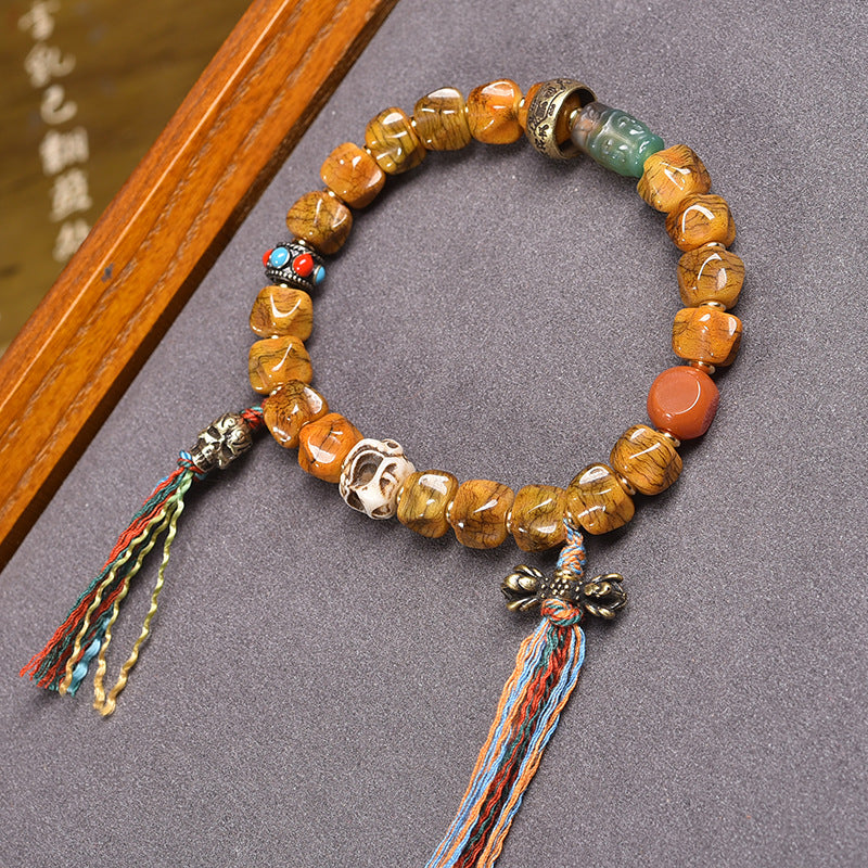 EverestArtstudios Bone Carved Seed-Pattern Tassel Bracelet
