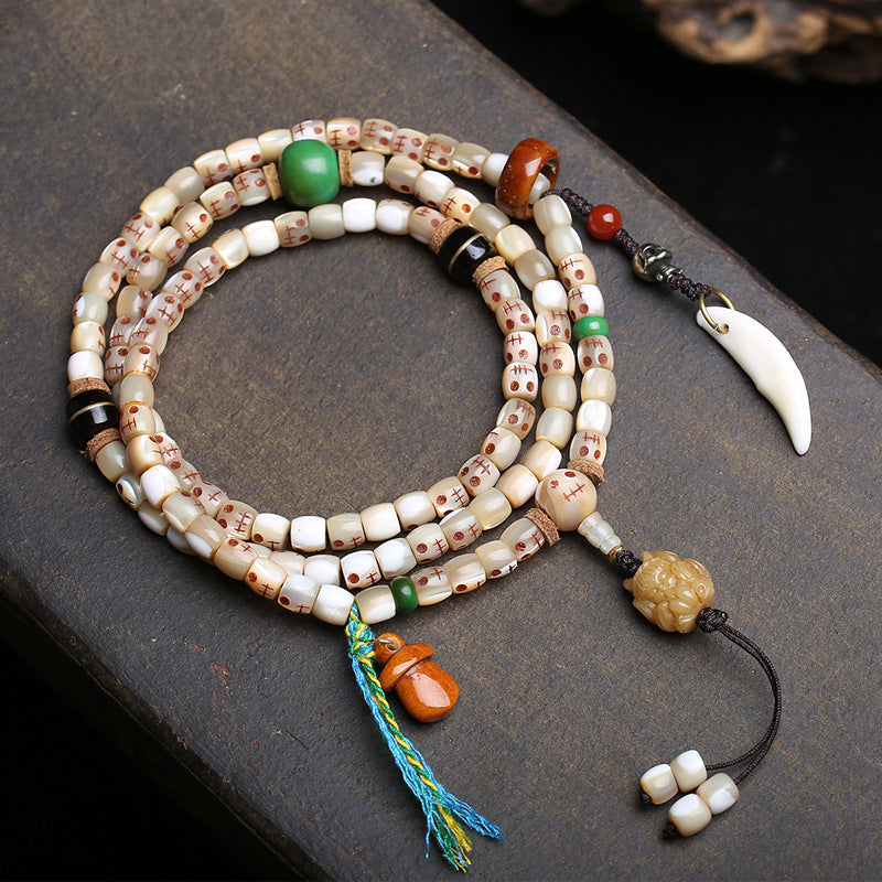 EverestArtstudios Carved Fish Bone 108-Bead Mala with Colorful Accents and Curved Pendant