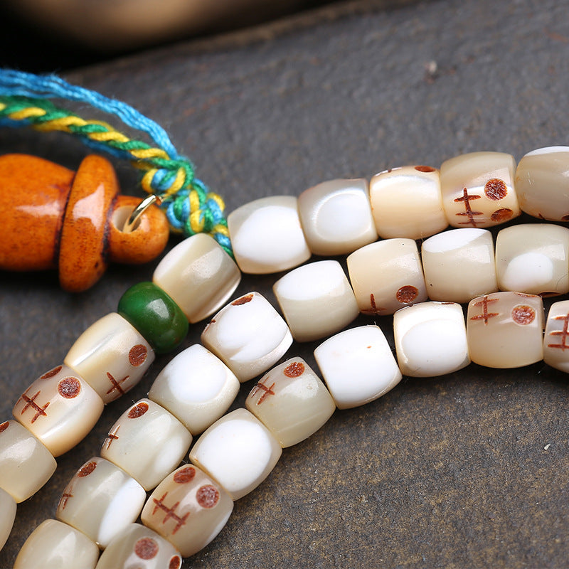 EverestArtstudios Carved Fish Bone 108-Bead Mala with Colorful Accents and Curved Pendant