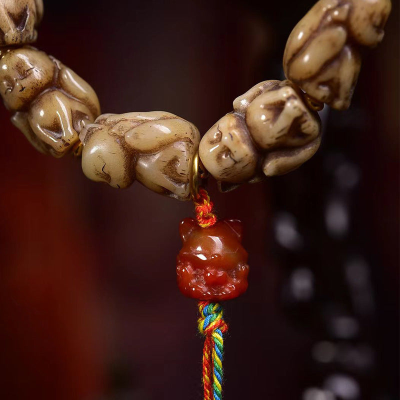 EverestArtstudios Bone Sculpted Fox Bead Tassel Bracelet