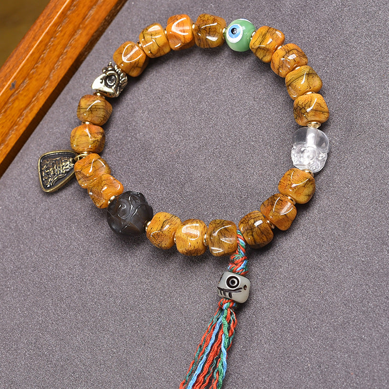 EverestArtstudios Bone Carved Seed-Pattern Tassel Bracelet