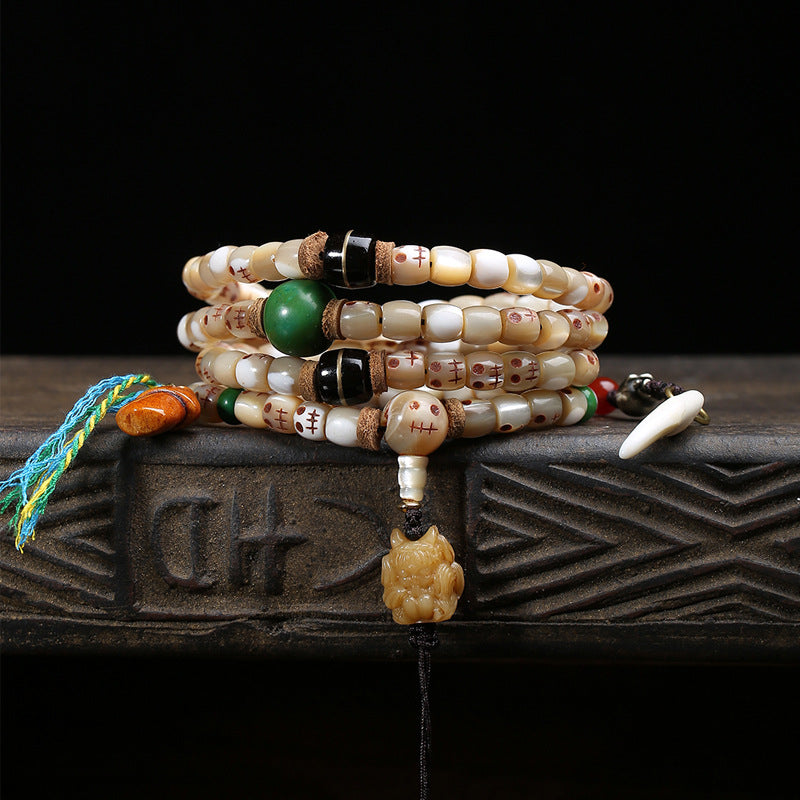 EverestArtstudios Carved Fish Bone 108-Bead Mala with Colorful Accents and Curved Pendant