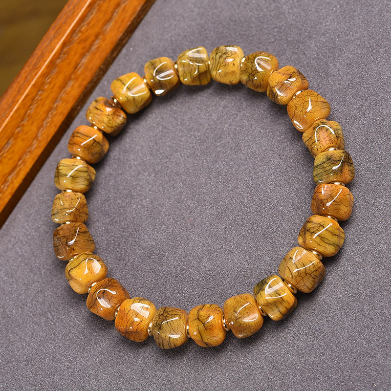 EverestArtstudios Bone Carved Seed-Pattern Tassel Bracelet