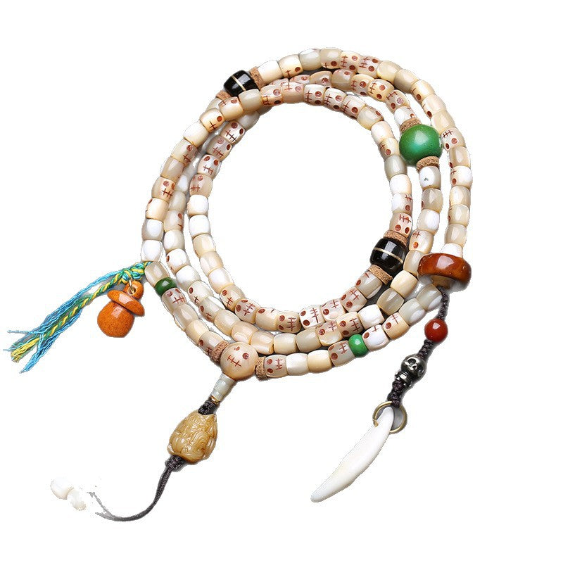 EverestArtstudios Carved Fish Bone 108-Bead Mala with Colorful Accents and Curved Pendant