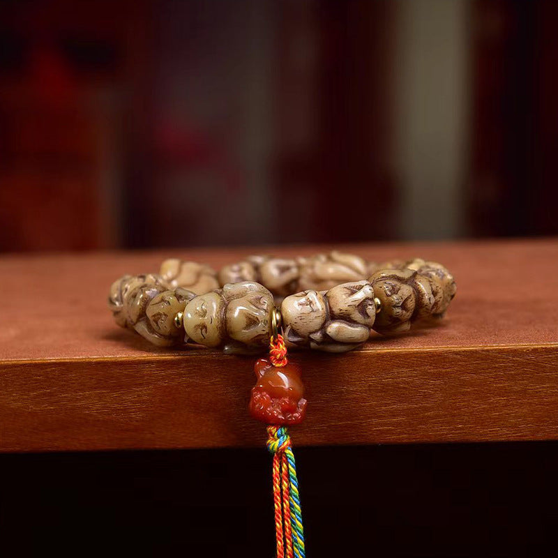 EverestArtstudios Bone Sculpted Fox Bead Tassel Bracelet