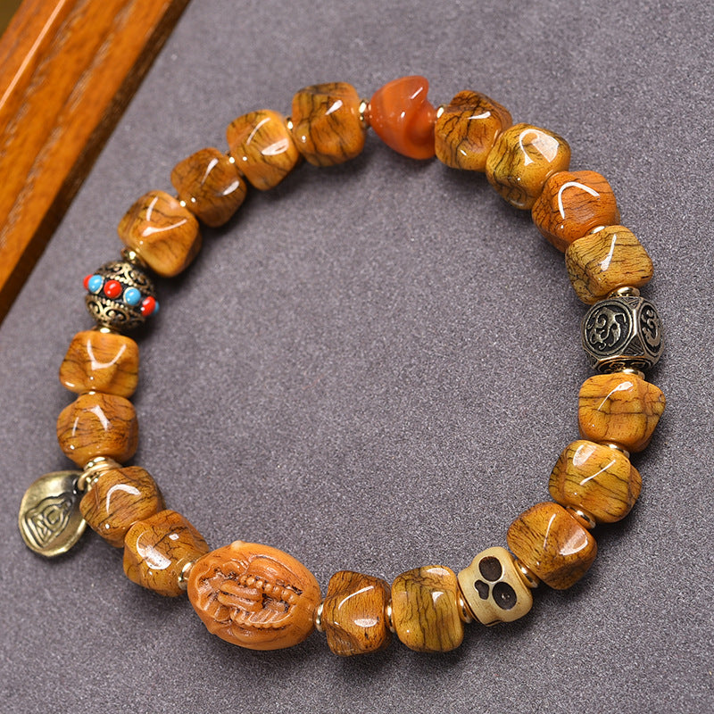 EverestArtstudios Bone Carved Seed-Pattern Tassel Bracelet