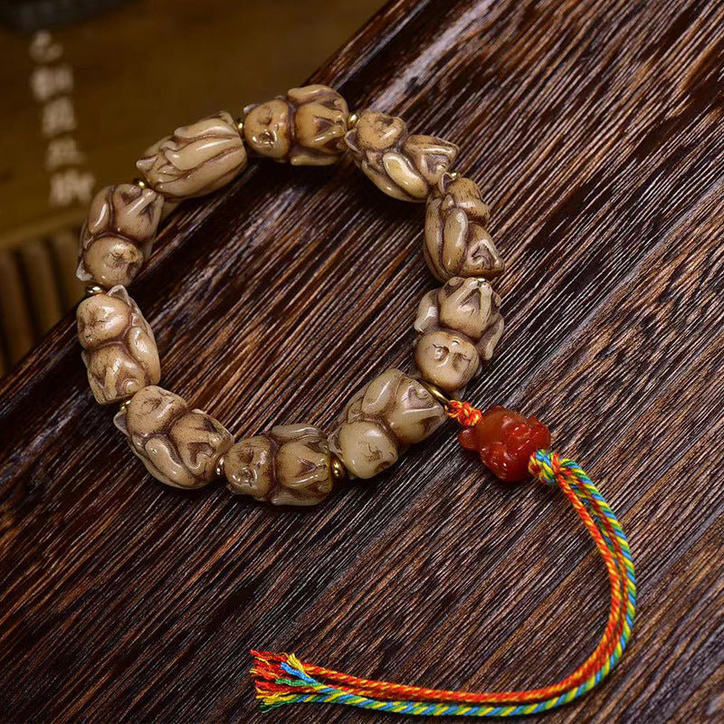 EverestArtstudios Bone Sculpted Fox Bead Tassel Bracelet