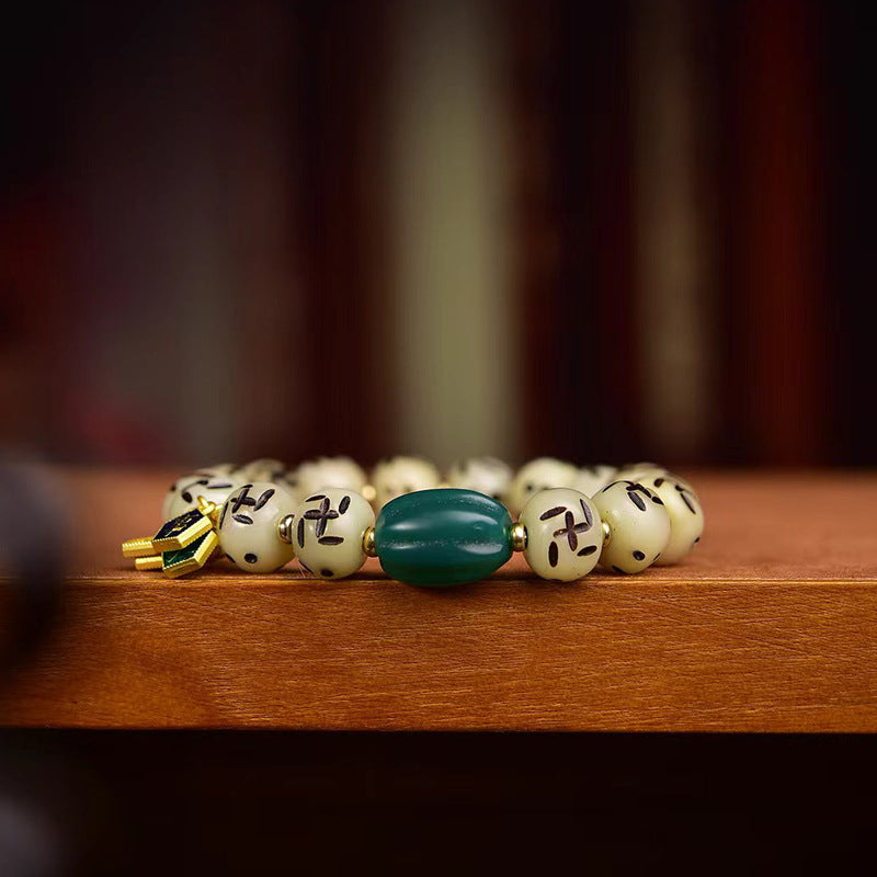 EverestArtstudios Bone Auspicious Symbol Carved Bead Bracelet