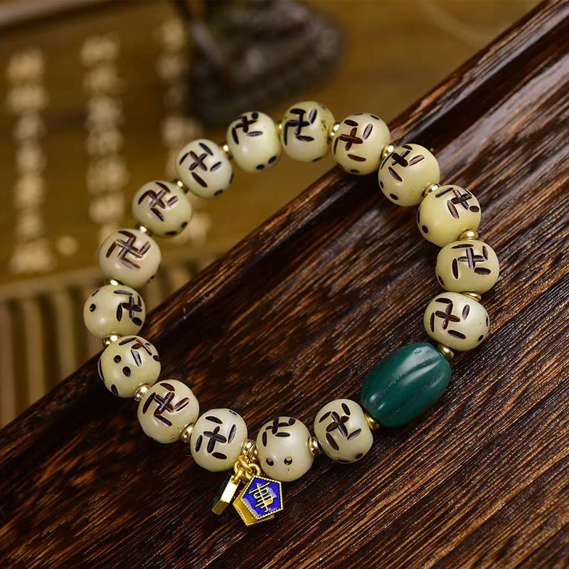 EverestArtstudios Bone Auspicious Symbol Carved Bead Bracelet