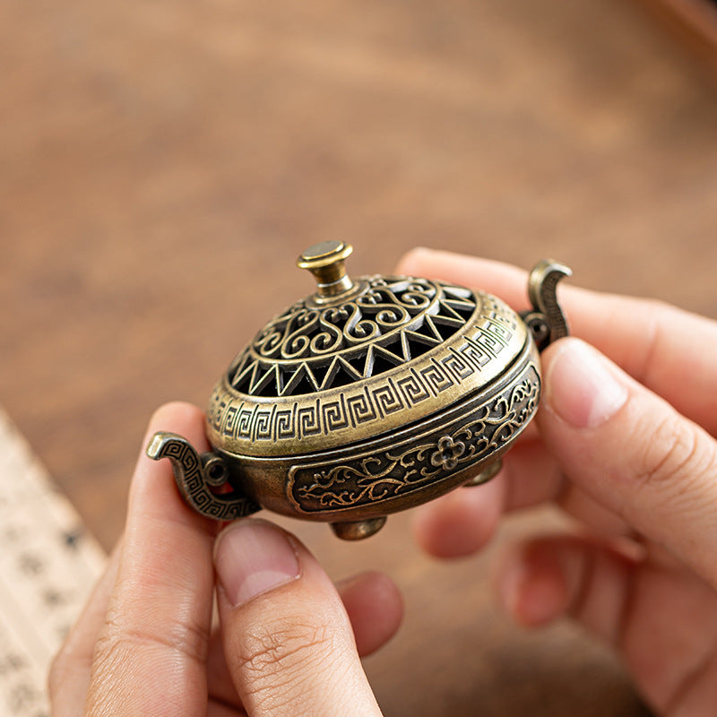 Cross-border explosion binaural antique incense burner exquisite pattern hollow three-legged burner household Xuande burner incense burner desktop ornament