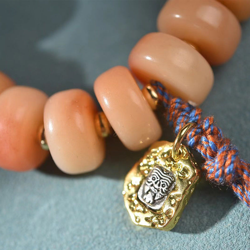 EverestArtstudios Camel Bone Blush Disc Bead Tassel Bracelet