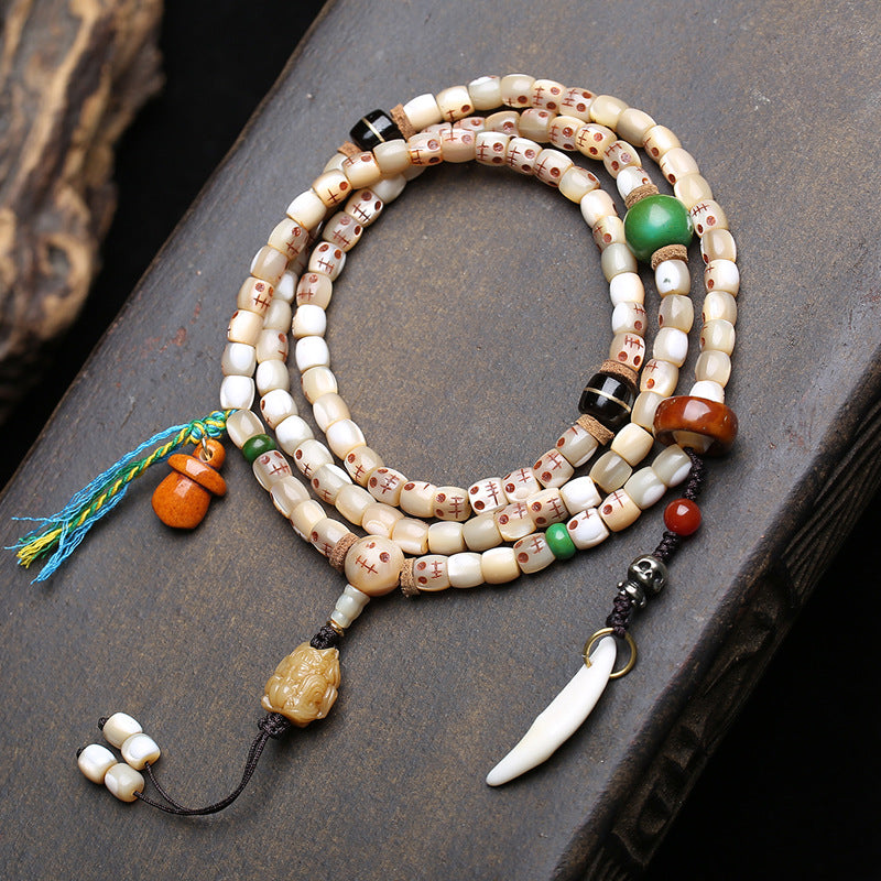 EverestArtstudios Carved Fish Bone 108-Bead Mala with Colorful Accents and Curved Pendant