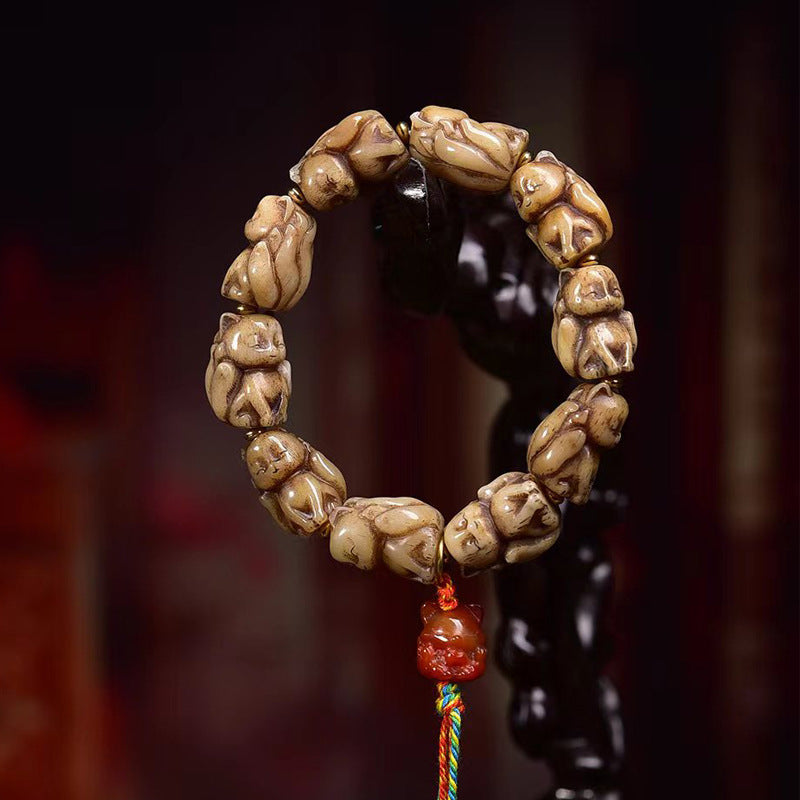 EverestArtstudios Bone Sculpted Fox Bead Tassel Bracelet