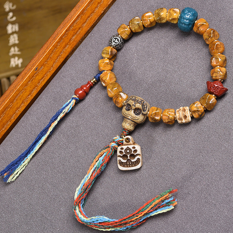 EverestArtstudios Bone Carved Seed-Pattern Tassel Bracelet