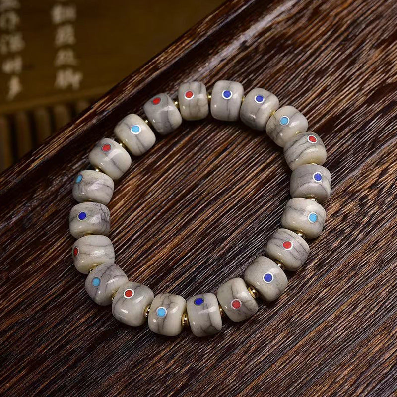 EverestArtstudios Bone Inlaid Barrel Bead Tassel Bracelet