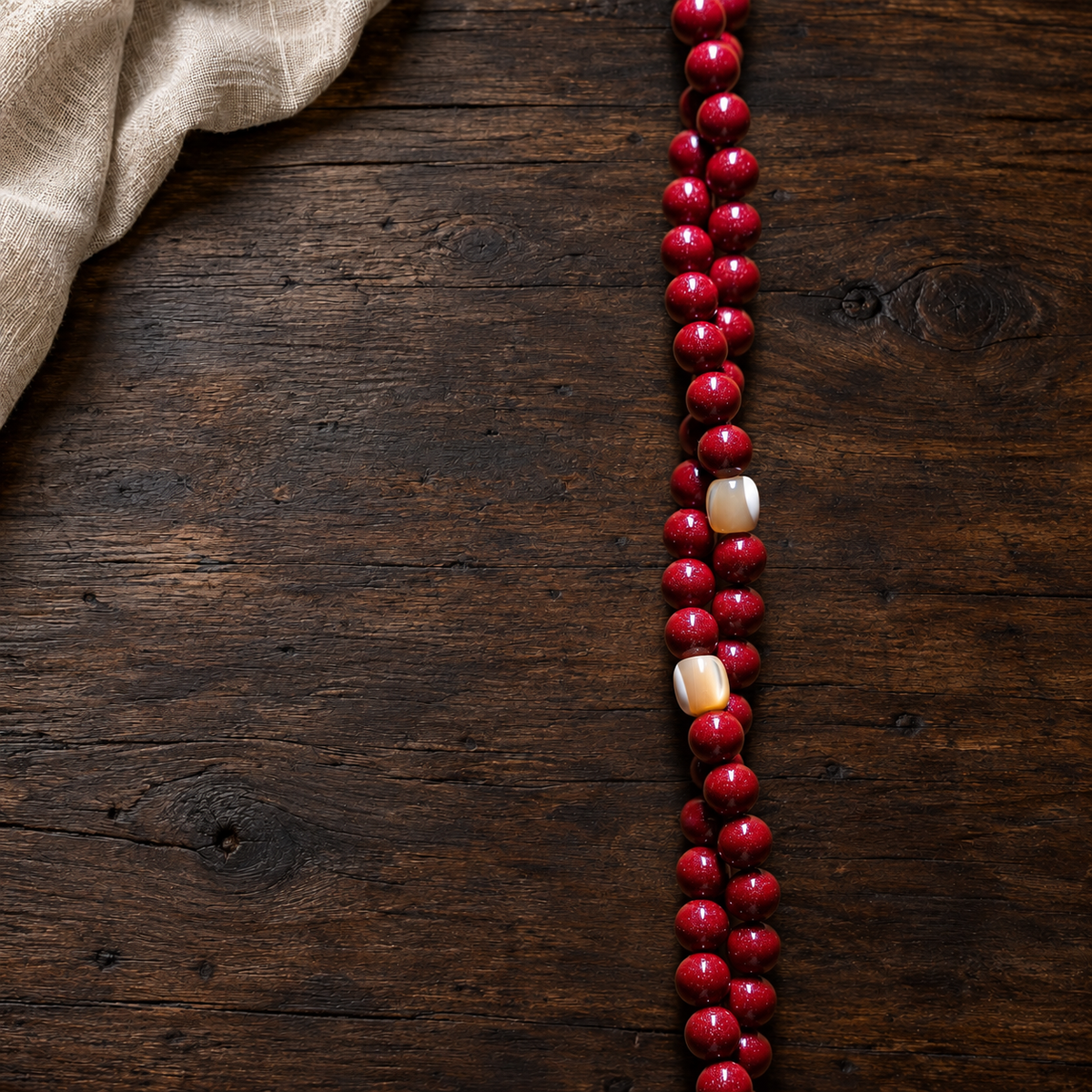 05 strand detail — red cinnabar composite 108-bead mala