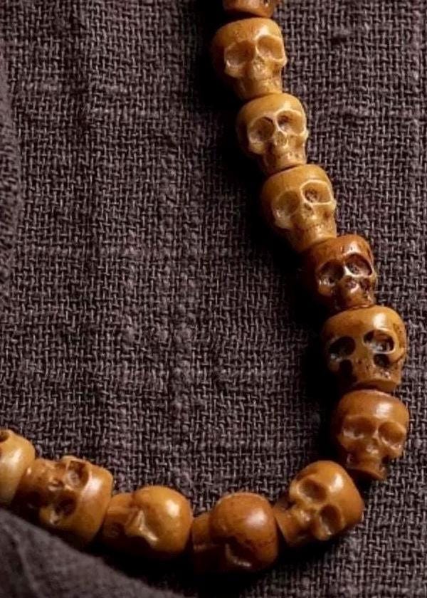 Handcrafted Tibetan Skull Shape Yak Bone Mala Bracelet, 108 Beads Buddhist Prayer Beads for Meditation, Yoga, and Spiritual Healing