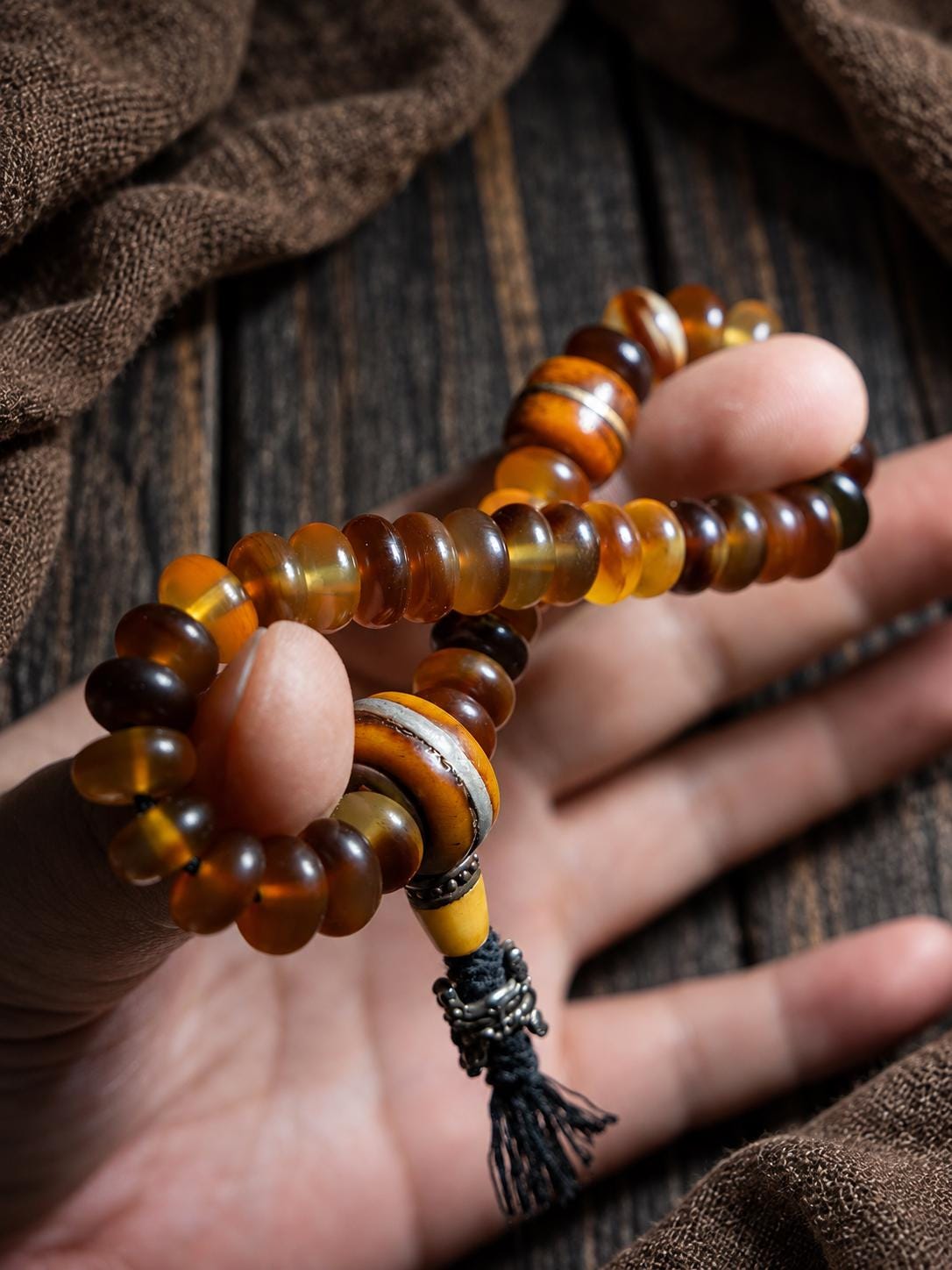 EverestArtStudios Amber-Toned Sheep Horn Bracelet, Tibetan Style with Yak Bone and Sandalwood Accents, Tassel or Guru Bead