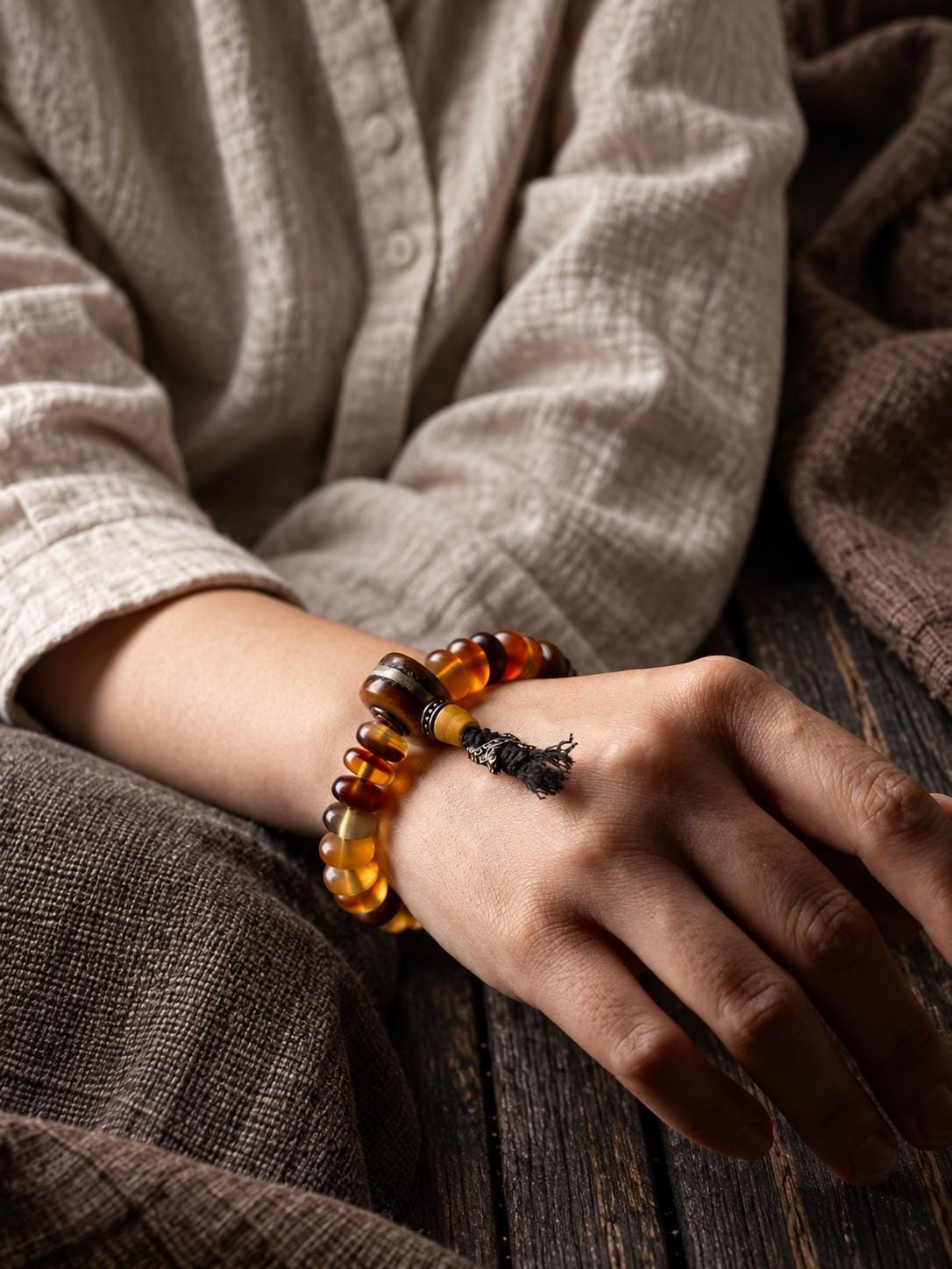 EverestArtStudios Amber-Toned Sheep Horn Bracelet, Tibetan Style with Yak Bone and Sandalwood Accents, Tassel or Guru Bead