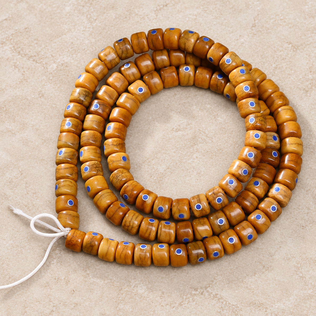 EverestArtstudios Aged Camel Bone and Lapis Inlaid Barrel-Bead 108-Bead DIY Strand — overall display