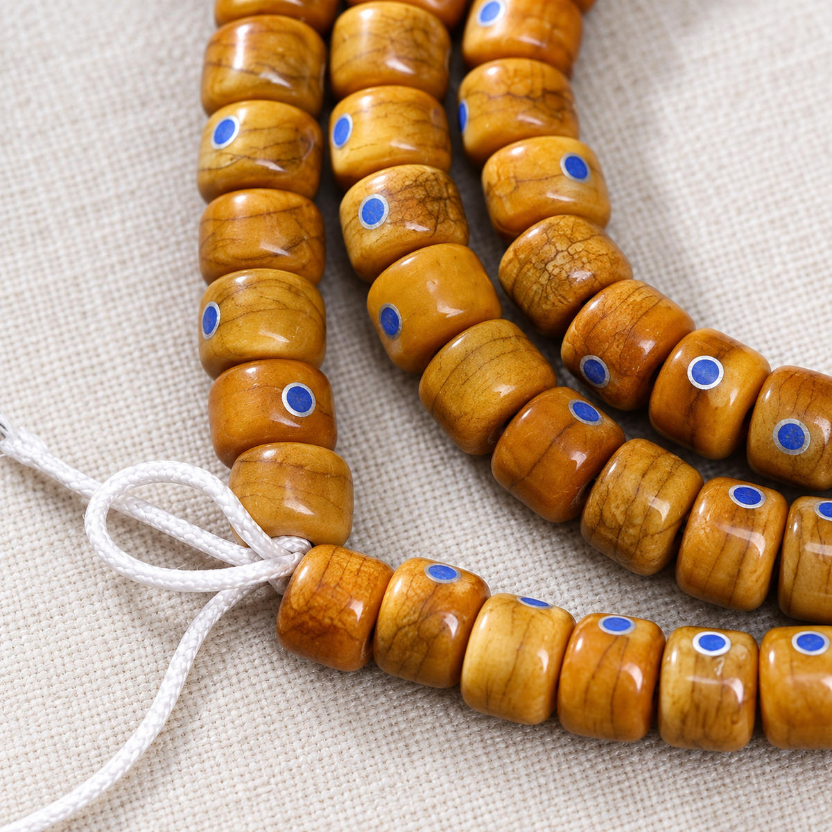 EverestArtstudios Aged Camel Bone and Lapis Inlaid Barrel-Bead 108-Bead DIY Strand — cord detail