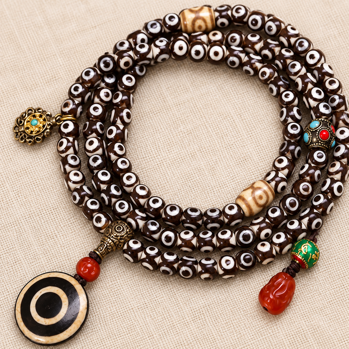 Mala agate rouge 108 perles Dzi trois yeux