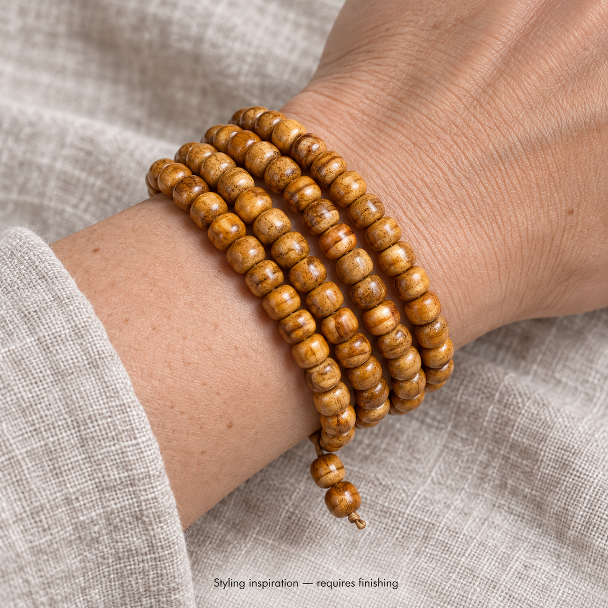 EverestArtstudios Natural Camel Bone and Passion Seed 108-Bead DIY Strand — wrist resting