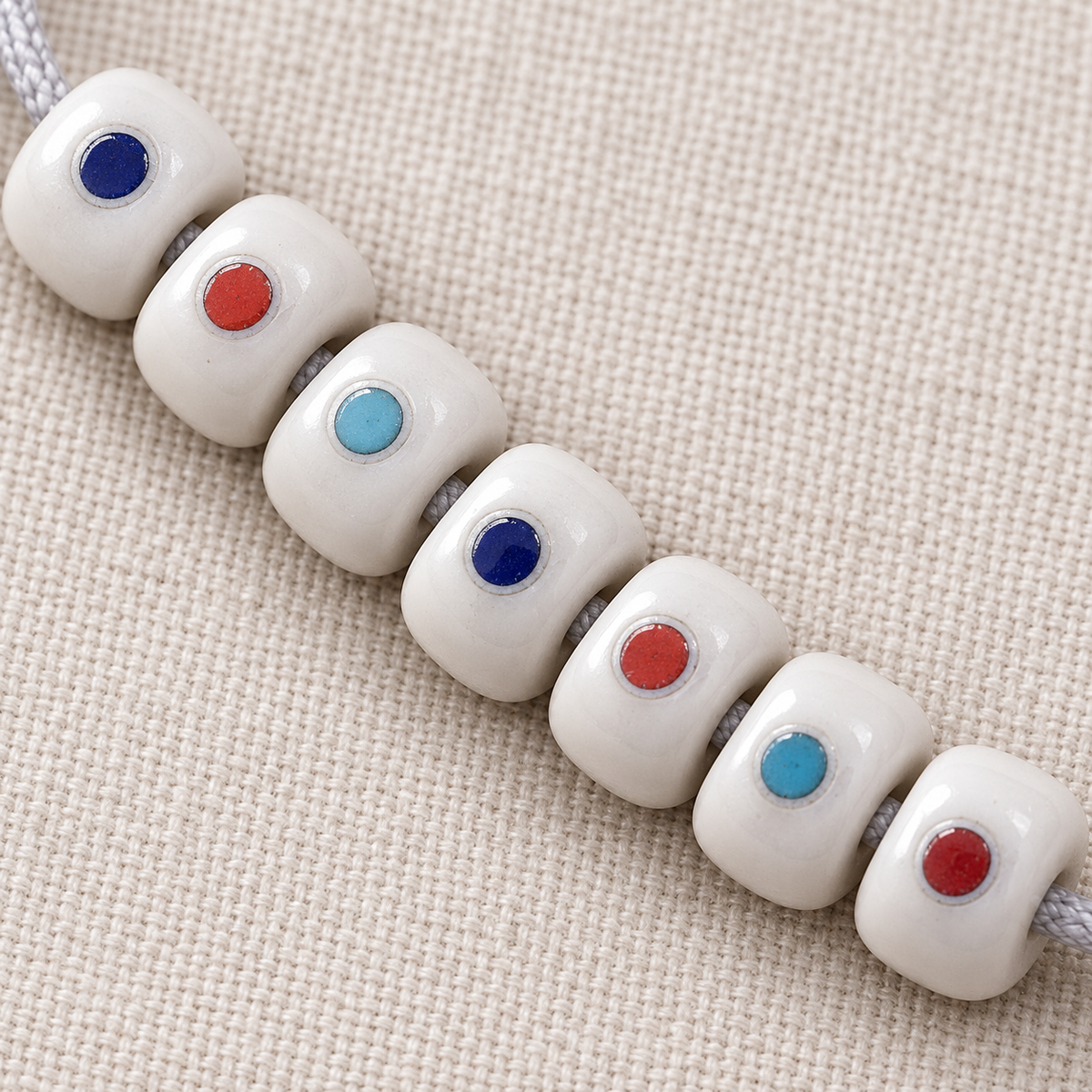 Fil 108 perles os de chameau et motif Wan