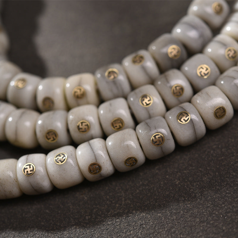 EverestArtstudios Aged Camel Bone Antique Copper Auspicious Wan 108-Bead DIY Strand — bead detail