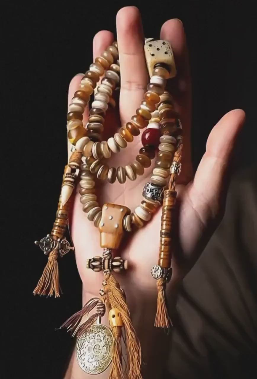 Load video: EverestArtStudios Tibetan-Style Twisted Goat Horn Mala Bracelet | 108 Beads | Original Design | Handmade Buddhist Prayer Beads
