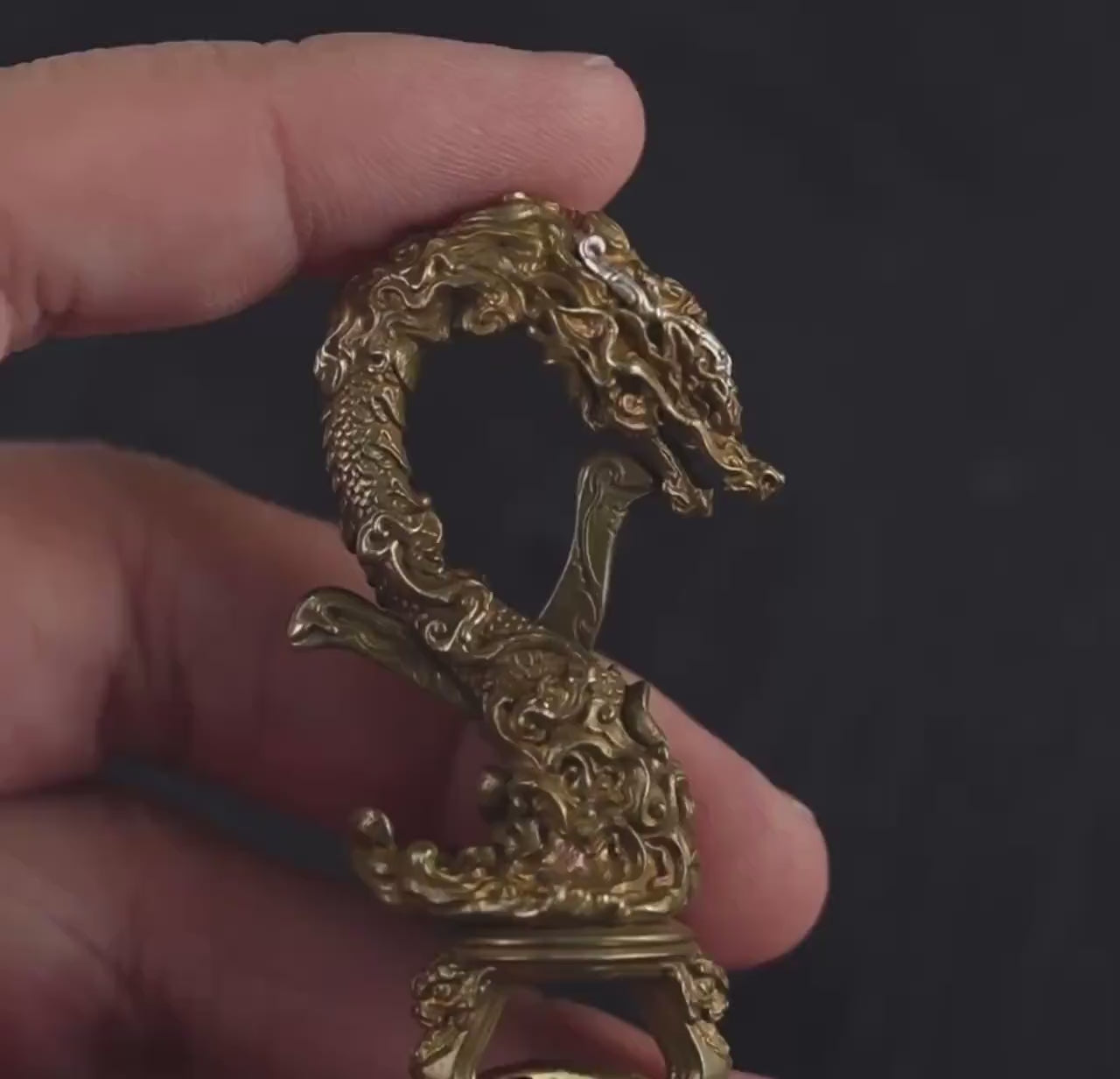 Load video: Handcrafted Tibetan Copper Dragon Keychain: Good Fortune Figurine
