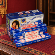 Satya incense collection on a Tibetan textile; assorted packaging shown